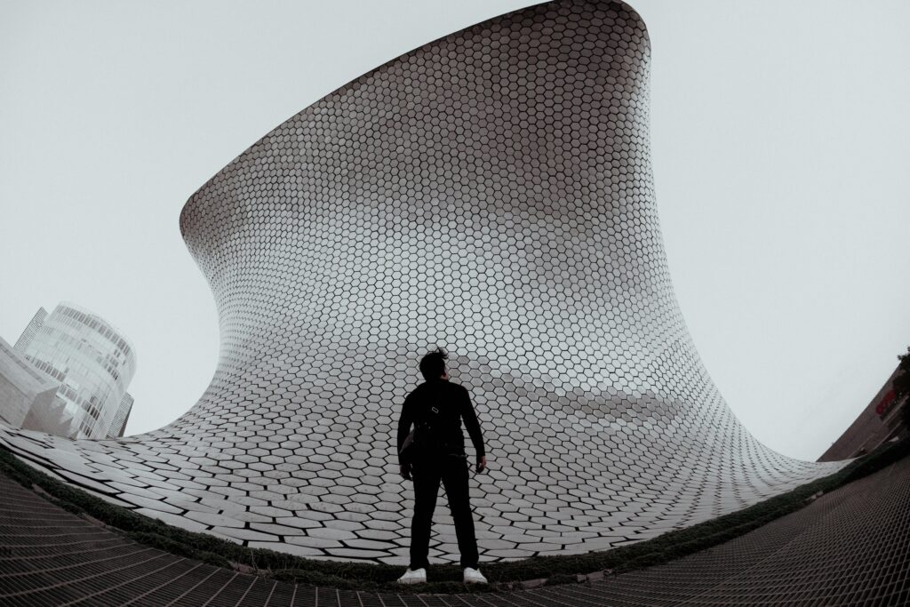 The shimmering, curved facade of Museo Soumaya in Mexico City, a striking modern contrast to the mural legacy of Diego Rivera housed in nearby institutions.