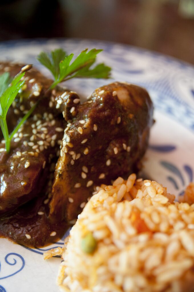 Traditional Dishes like Mole Poblano and Tamales: Famous food in Mexico City, culinary highlights in CDMX.