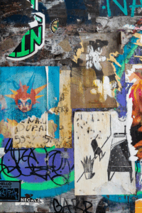 Graffiti-covered wall in Mexico City — reflecting the fragmented, expressive urban landscape explored in The Mexico City Reader, a standout title featured in books and films about Mexico City.