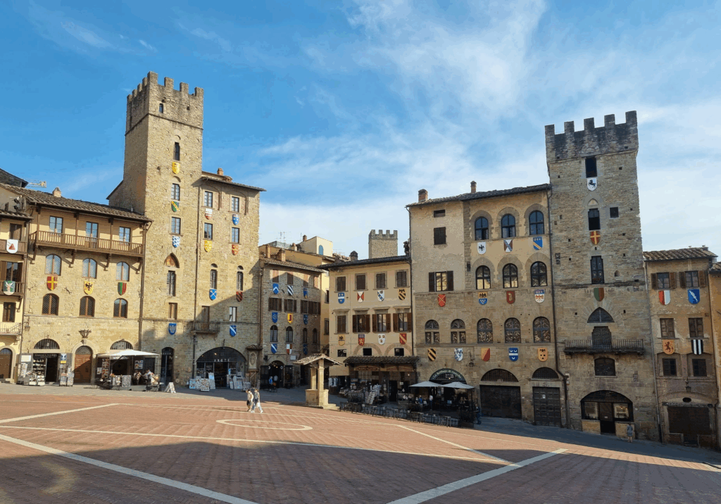 Arezzo’s Piazza Grande, where Guido woos Dora in Life Is Beautiful, remains one of the most iconic movies set in Tuscany — blending joy, love, and resilience against a historic backdrop.