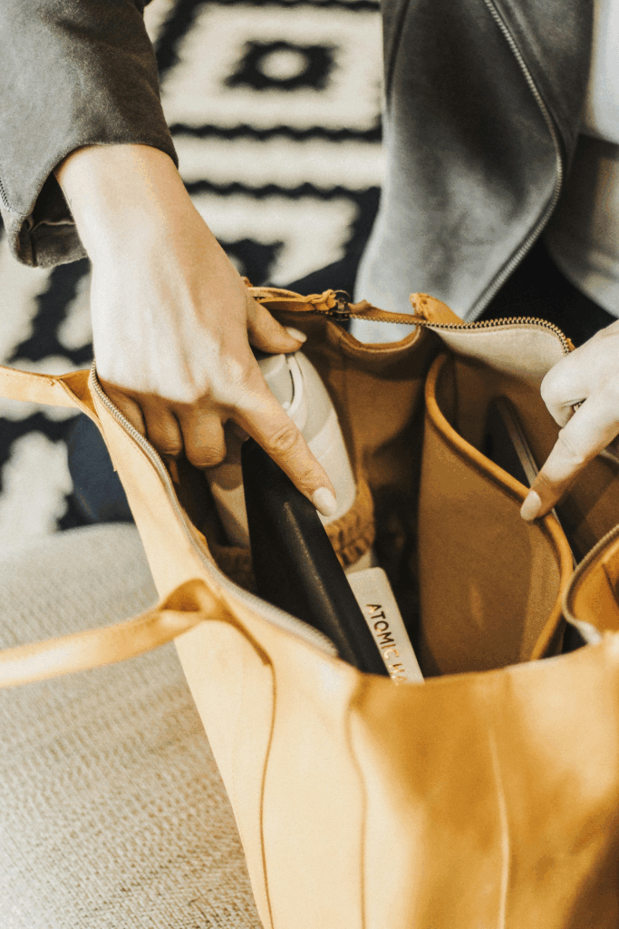 Woman packing her personal item for a trip to Tuscany.
