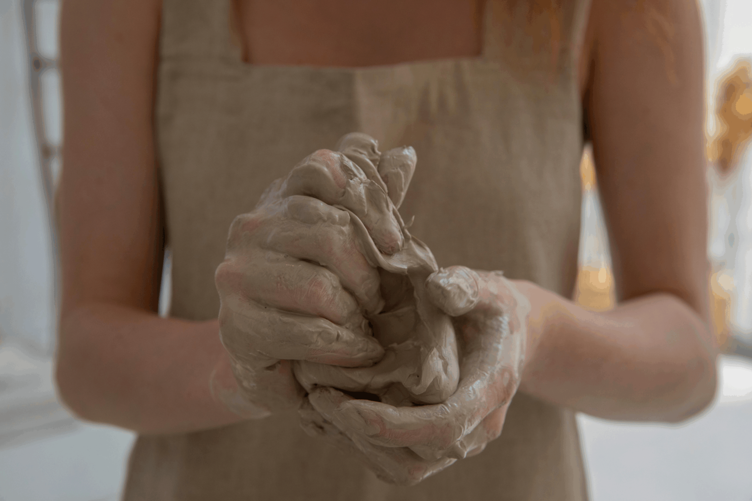 Woman working with clay, the way the Jōmon people would have in ancient Japan.