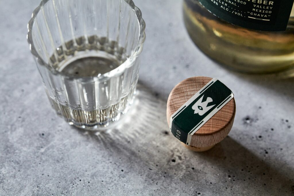 A small glass of artisanal mezcal served during a private tasting and contemporary art tour in Roma Norte, Mexico City