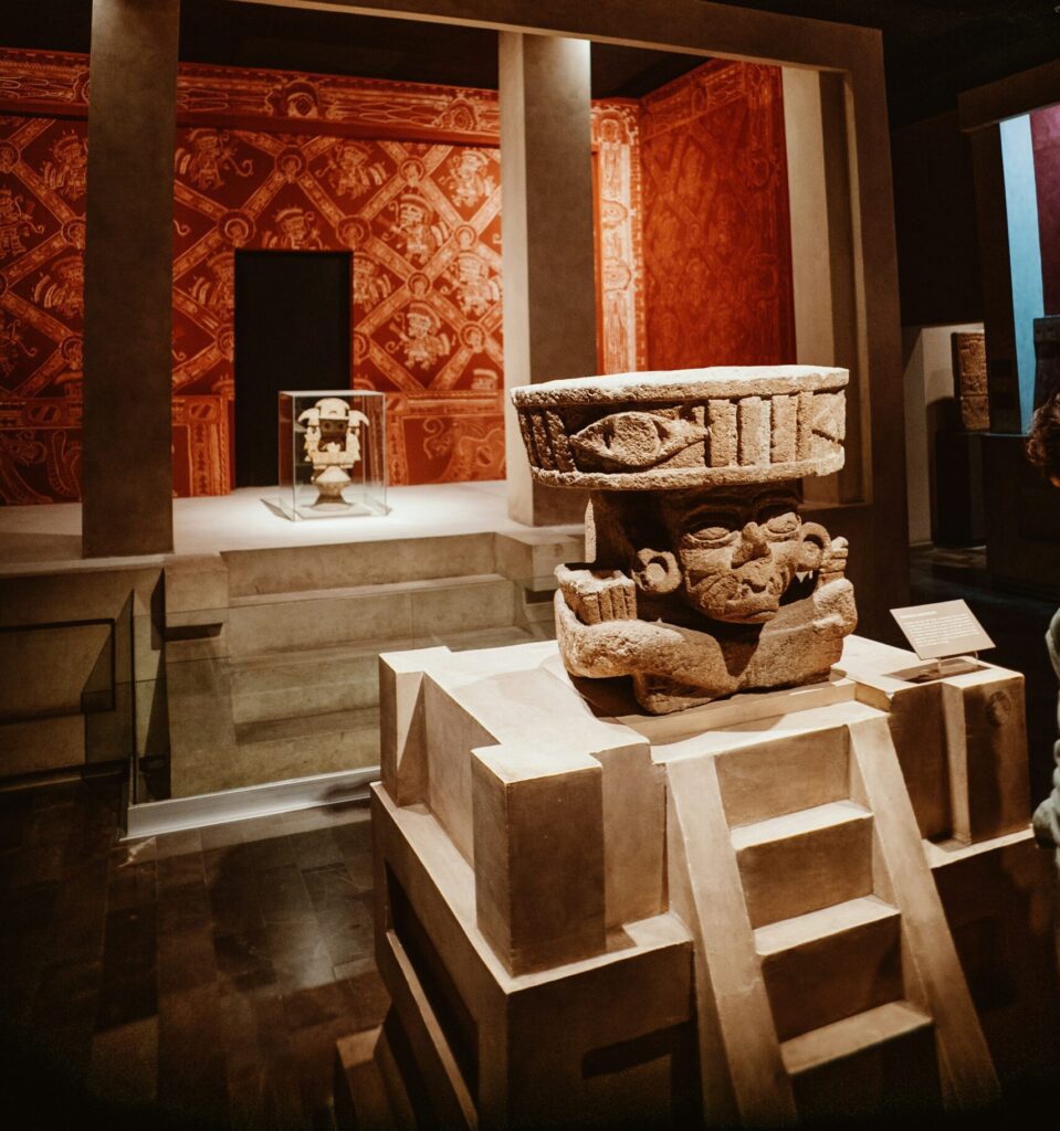 Prehistoric sculpture on display during a private tour of the National Museum of Anthropology in Mexico City, showcasing the depth of ancient Mesoamerican history