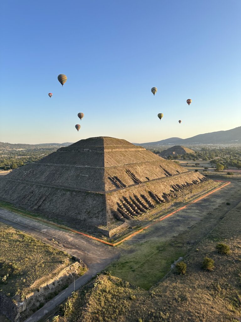 Floating over the pyramids of Teotihuacán at sunrise — a breathtaking Mexico City experience from above